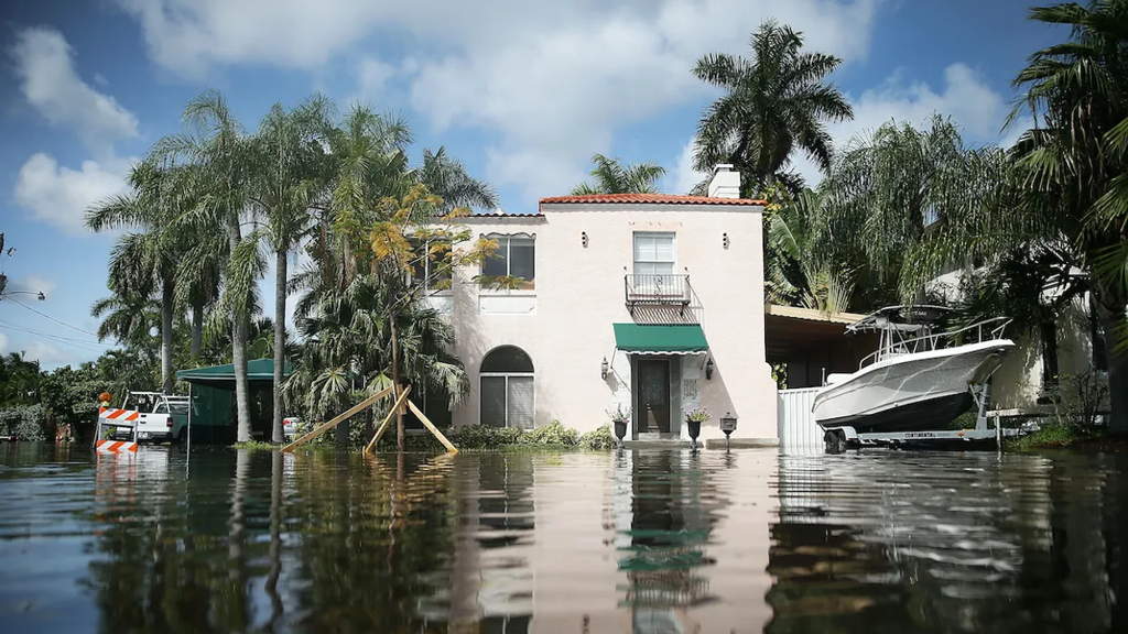 A Home Is Surrounded By Floodwater
